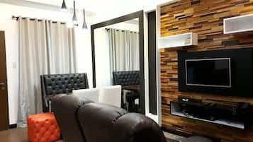 Condo, 2 Bedrooms | Living room | Flat-screen TV