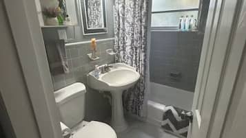 Bathtub, hair dryer, towels, soap