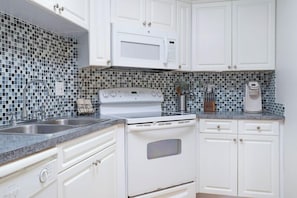 Superior Condo, Multiple Beds | Private kitchen | Full-sized fridge, microwave, oven, stovetop