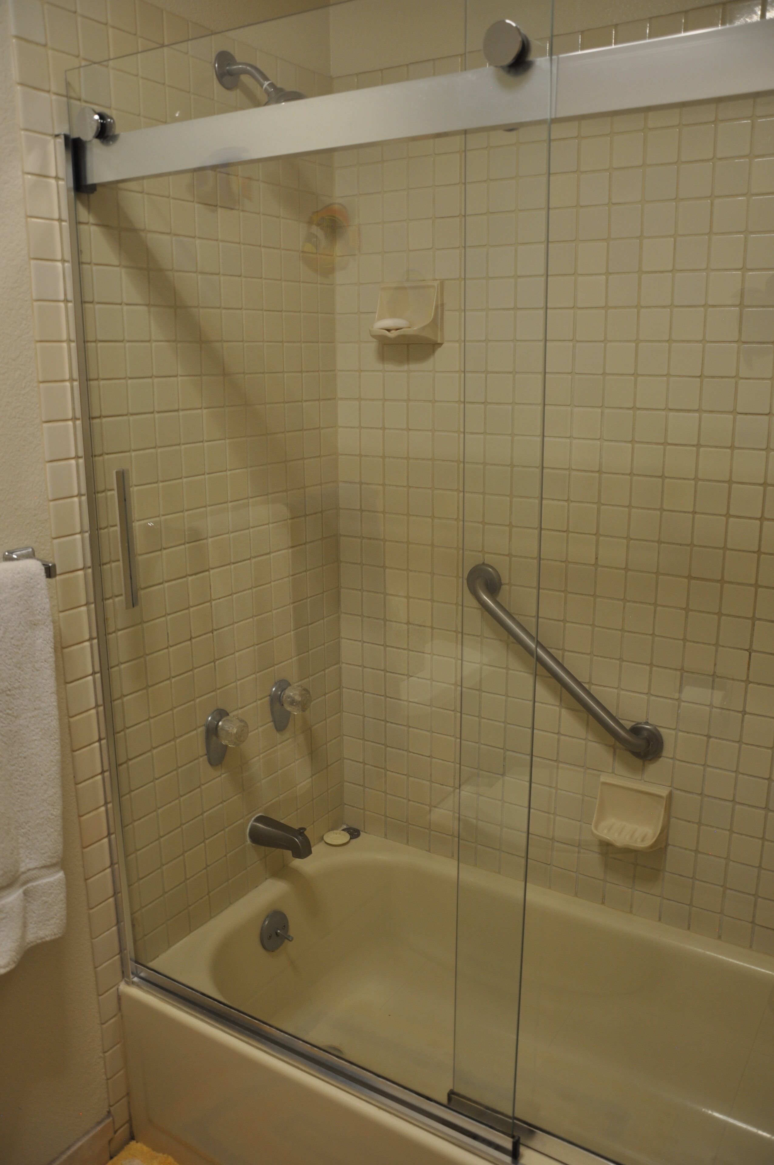 Combined shower/tub, hair dryer, towels, soap