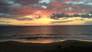 A beach with a sunset and ocean view. -   Outstanding Location in Maui  South Kihei & Wailea  (Kihei)