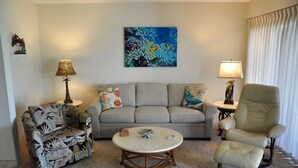 A living room with a sofa, two armchairs, a coffee table, and two lamps. -   Outstanding Location in Maui  South Kihei & Wailea  (Kihei)