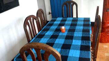Deluxe Apartment, Garden View, Beachside | In-room dining
