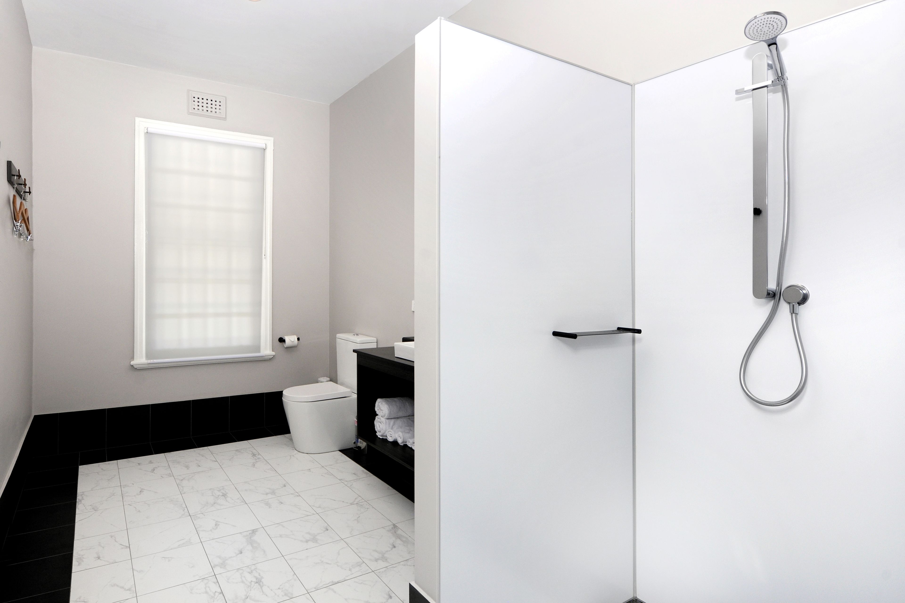 king studio | bathroom | shower, designer toiletries, hair dryer, towels