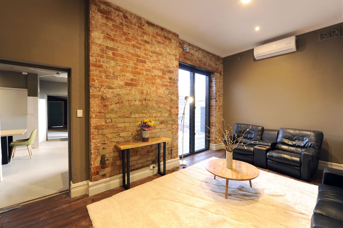 three bedroom apartment | living room | flat-screen tv