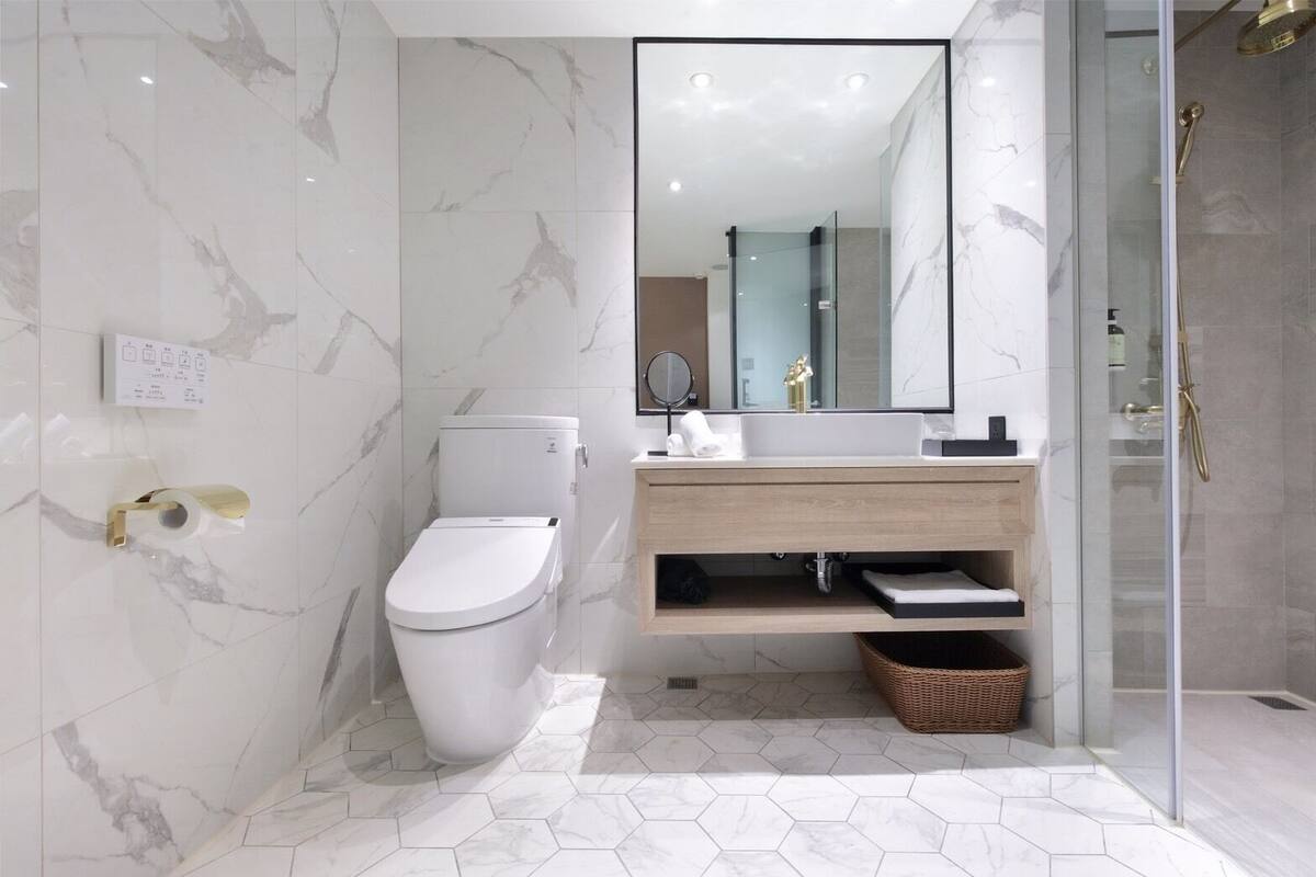 premier double room | bathroom | shower, hair dryer, slippers, electronic bidet