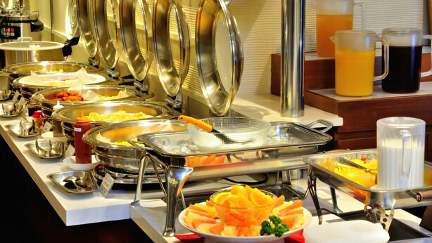 A buffet setup with various food items and beverages. - Grand Park Hotel Excel Kisarazu (Kisarazu)