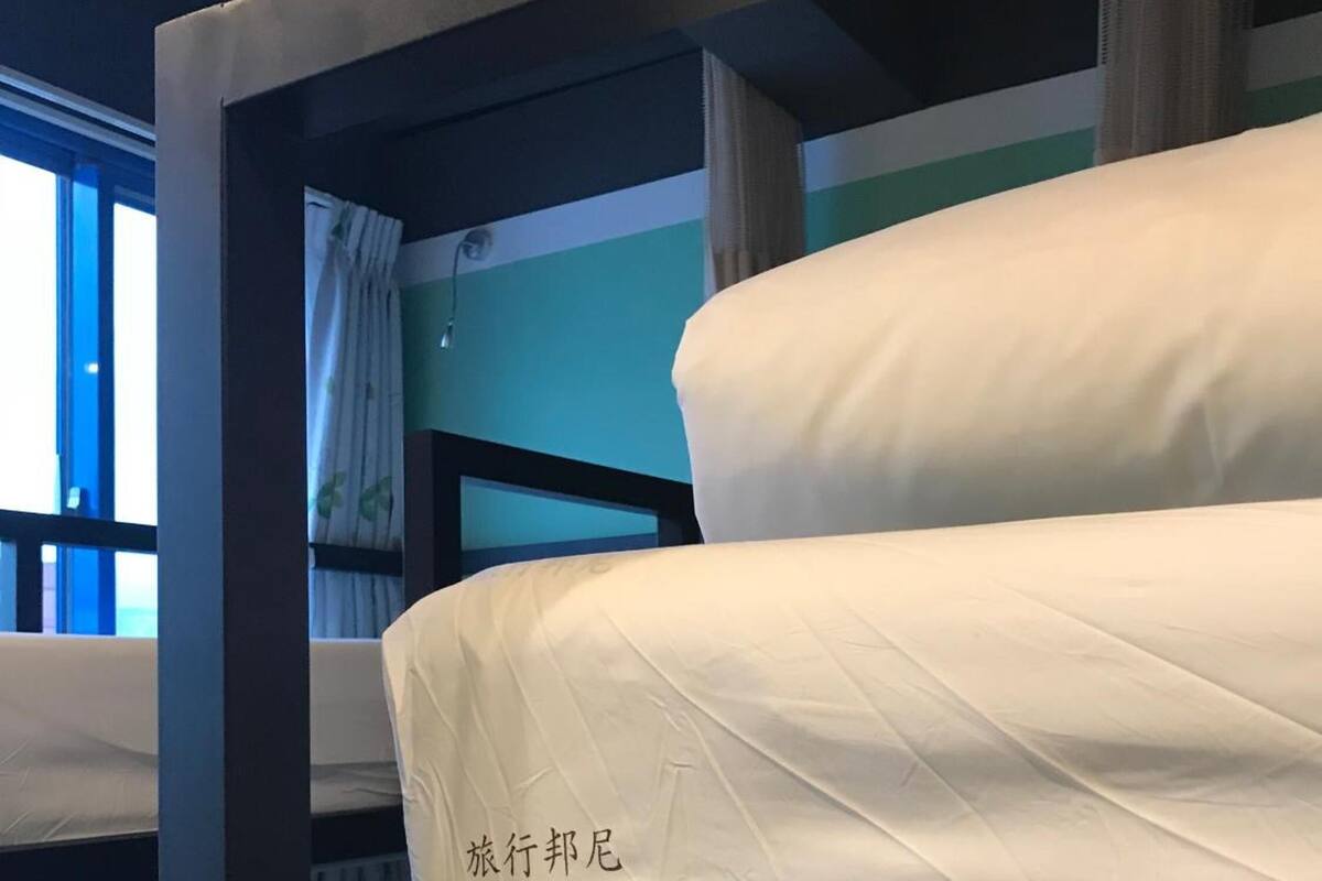 A bunk bed with a mattress that has text on it.