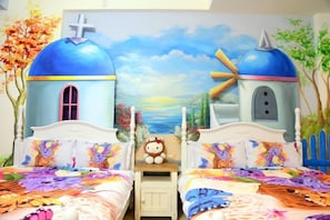 Two beds with colorful floral bedding, a serene mural, and a plush toy adorn this cozy retreat.