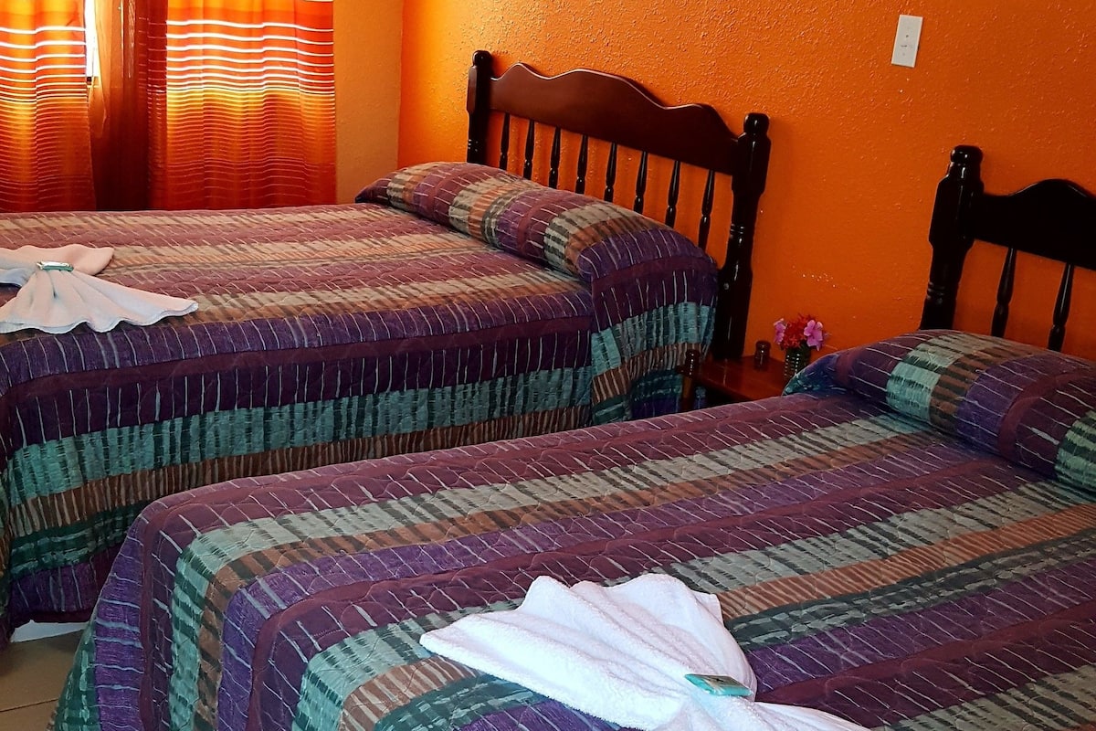 quadruple room, ocean view, beachfront | in-room safe, desk, iron/ironing board, free wifi