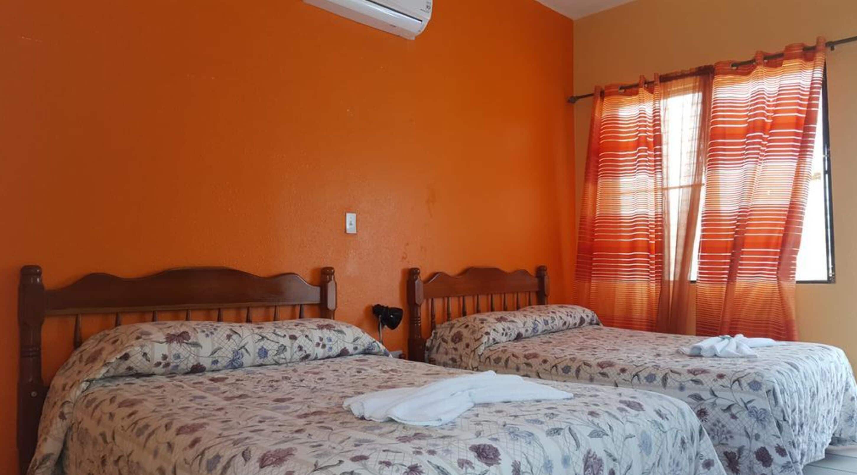 quadruple room, ocean view, beachfront | in-room safe, desk, iron/ironing board, free wifi