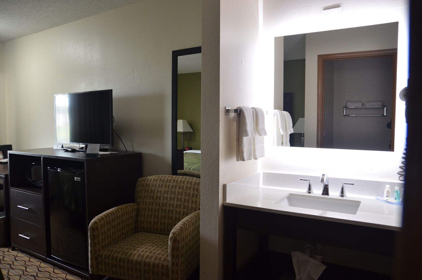 Premium bedding, desk, laptop workspace, blackout drapes