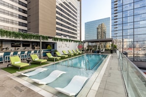 Outdoor pool, open 8 AM to 11:00 PM, pool loungers