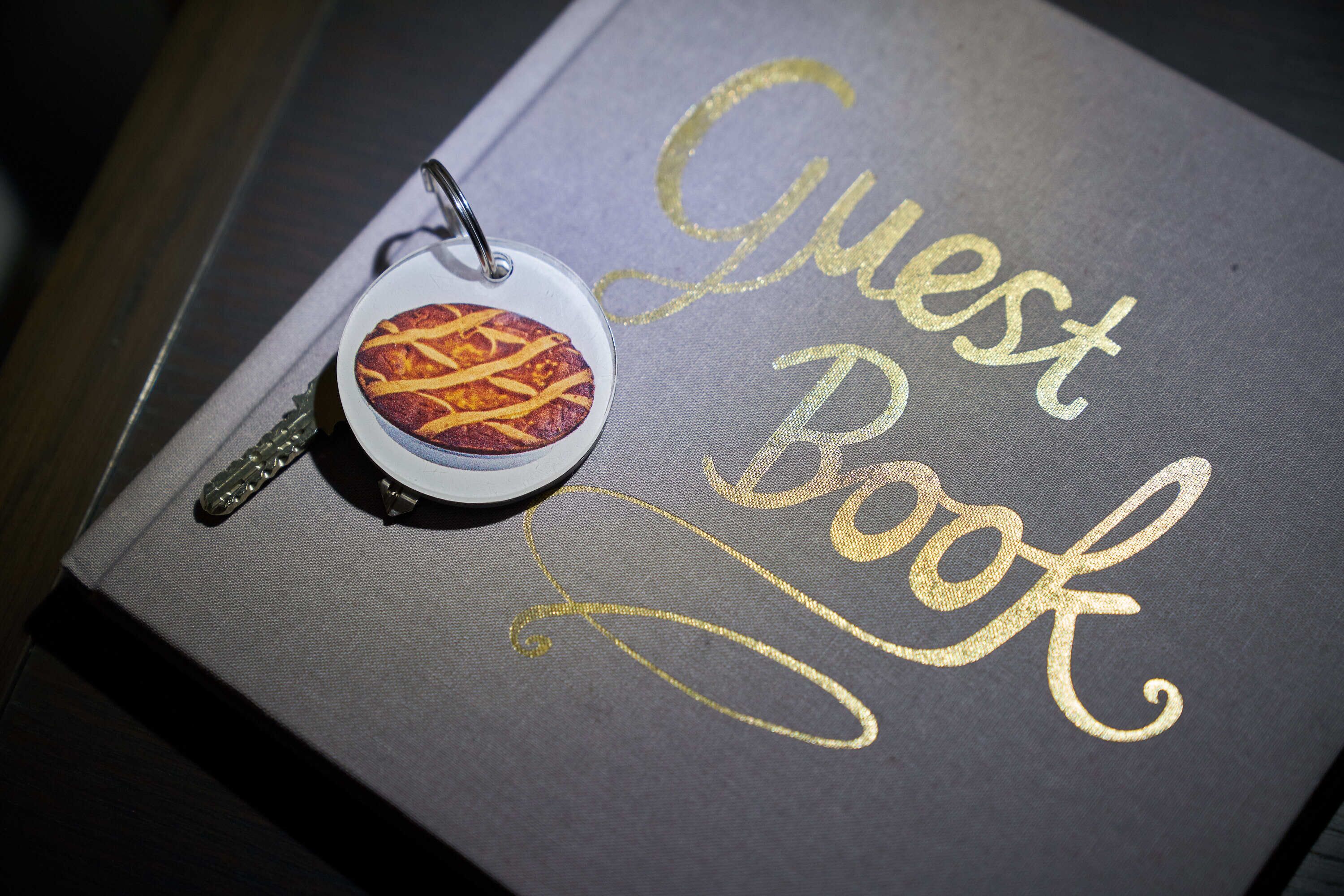 A guest book with a keychain attached.