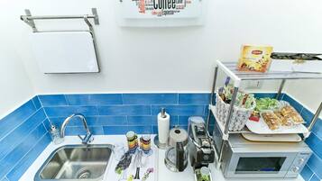 Fridge, microwave, cookware/dishes/utensils