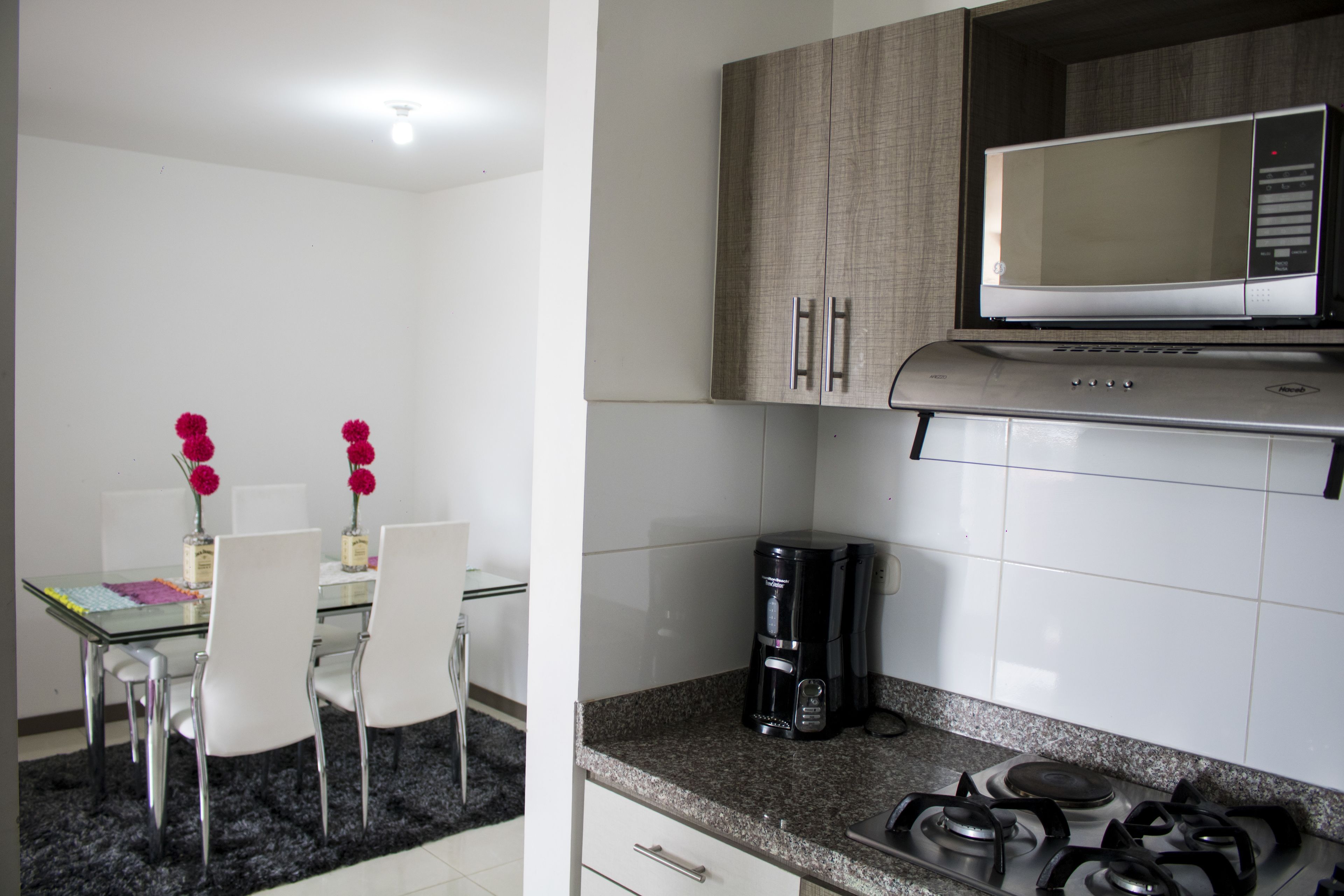 Full-sized fridge, microwave, stovetop, coffee/tea maker