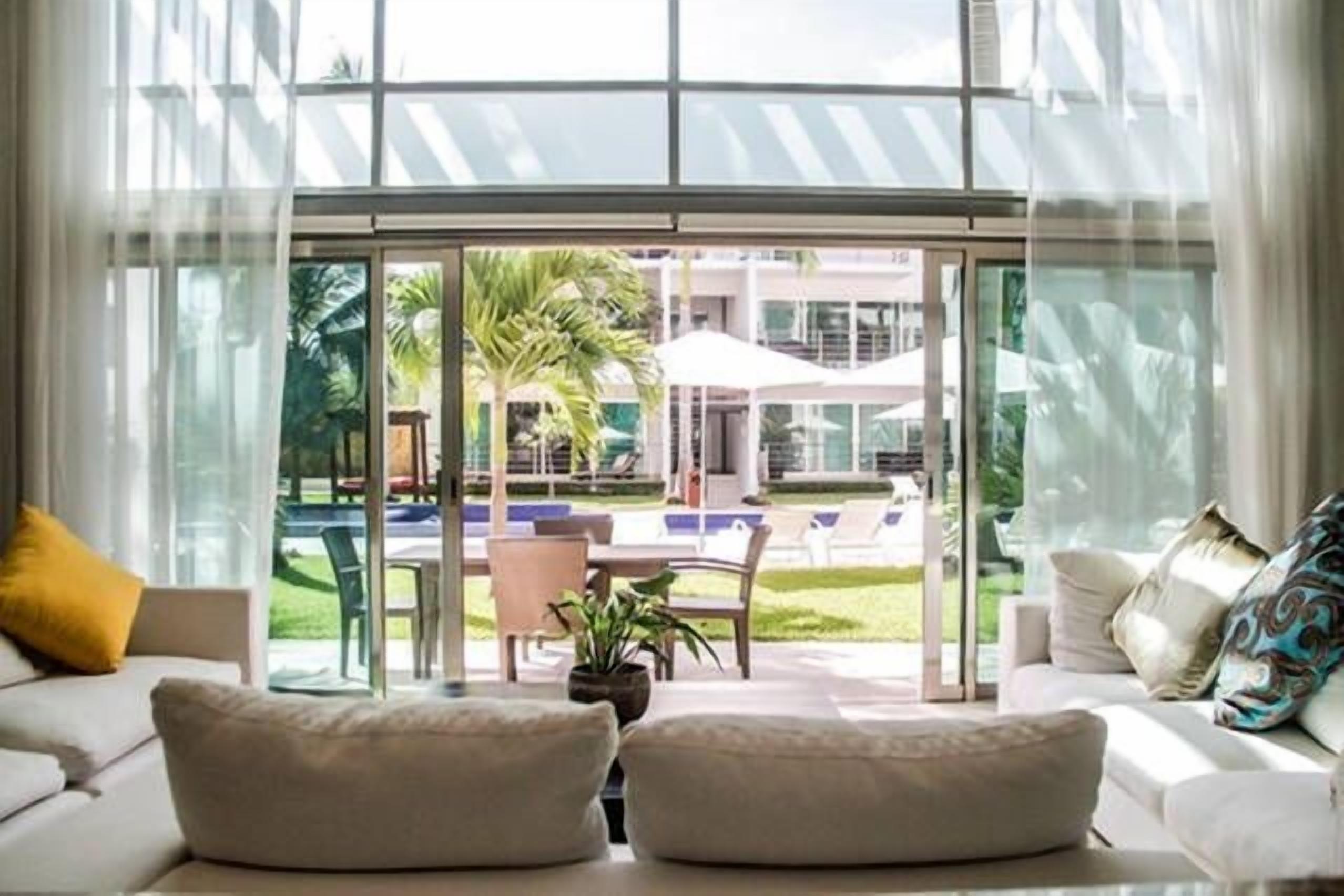 Luxury Condo, 2 Bedrooms, Pool View, Poolside | Living area | Flat-screen TV, DVD player