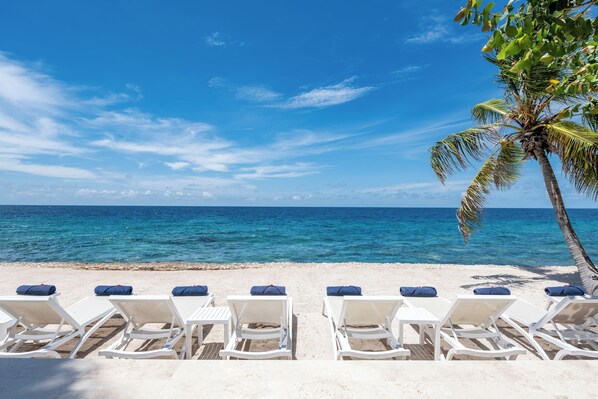 On the beach, sun-loungers, beach towels
