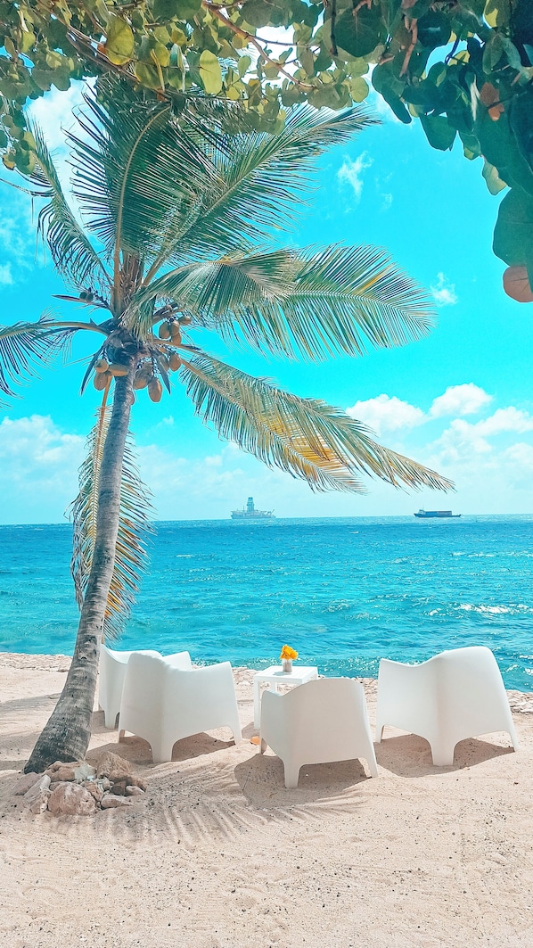 On the beach, sun loungers, beach towels