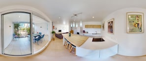 Enjoy cooking in this well-lit kitchen with a sink and ample workspace.