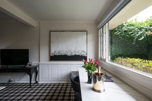 Signature Apartment, 1 Queen Bed | Living area | Flat-screen TV