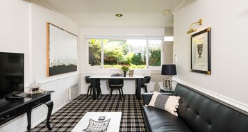 Signature Apartment, 1 Queen Bed | Living area | Flat-screen TV