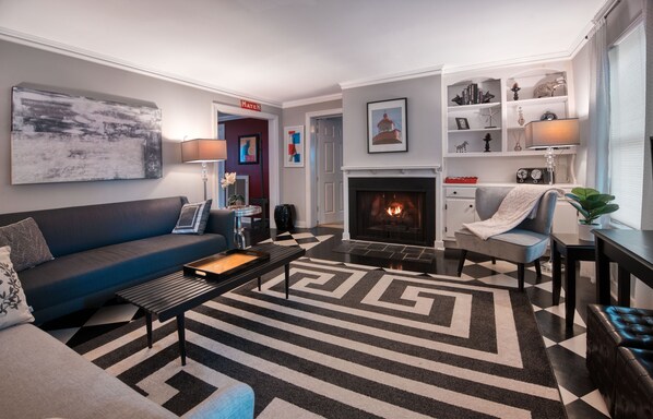 Smart TV, fireplace, books, printers