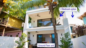 A two-story building with a ground floor unit and a two-bedroom option on the upper floor.