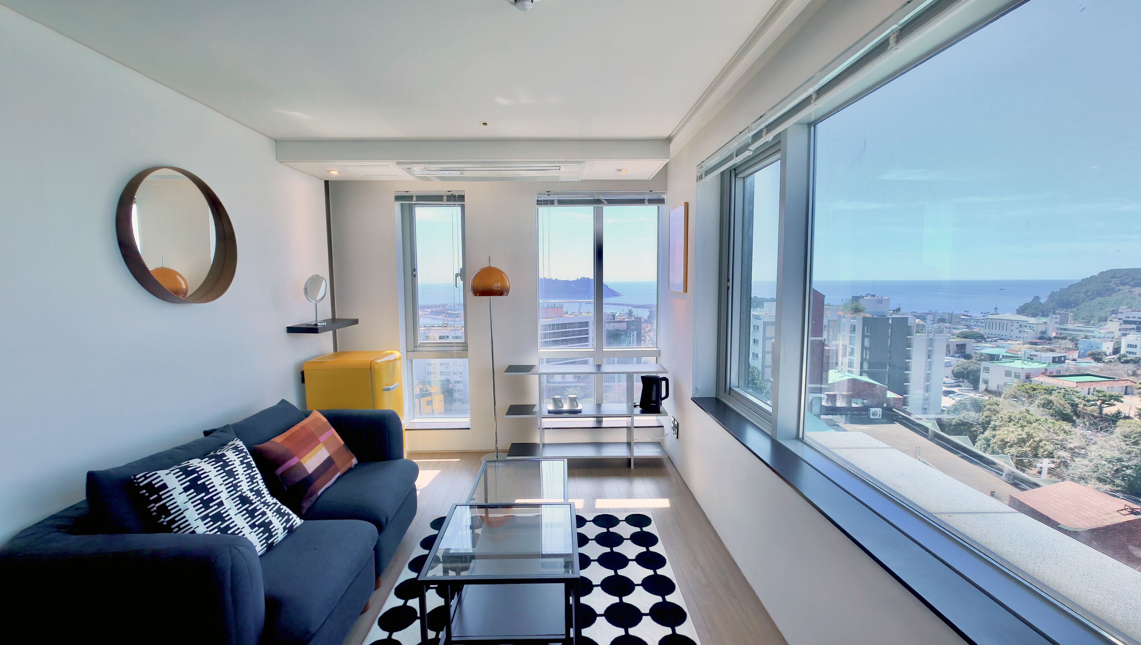 High Floor - The First Suite | Living area | 40-inch flat-screen TV with cable channels, TV, heated floors