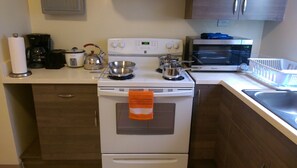 Family Apartment, 2 Bedrooms | Private kitchen | Full-size fridge, microwave, oven, stovetop
