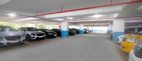 A multi-level parking garage with cars parked in designated spaces.