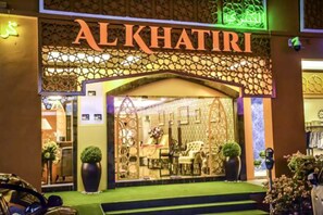 The exterior of Al Khatiri hotel with a decorative facade and a well-lit entrance. - Al Khatiri Hotel (Kota Bharu)