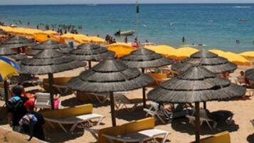 White sand, beach cabanas, sun loungers, beach umbrellas