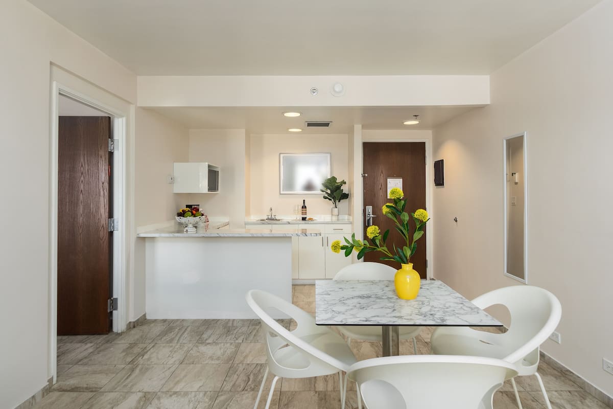 junior suite, 1 king bed with sofa bed | living area | 46-inch flat-screen tv with cable channels, tv