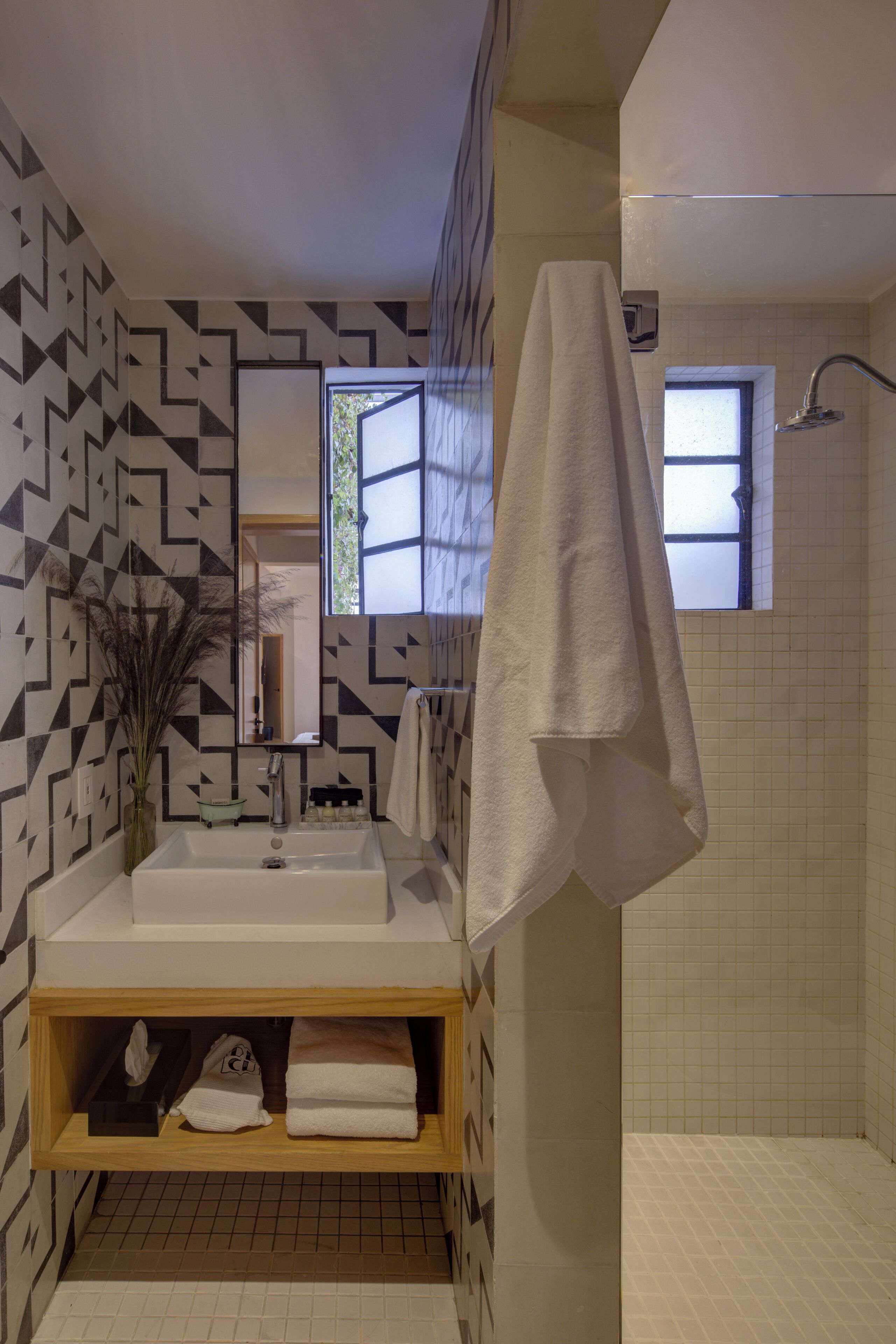 suite duplex | bathroom | shower, rainfall showerhead, hair dryer, towels