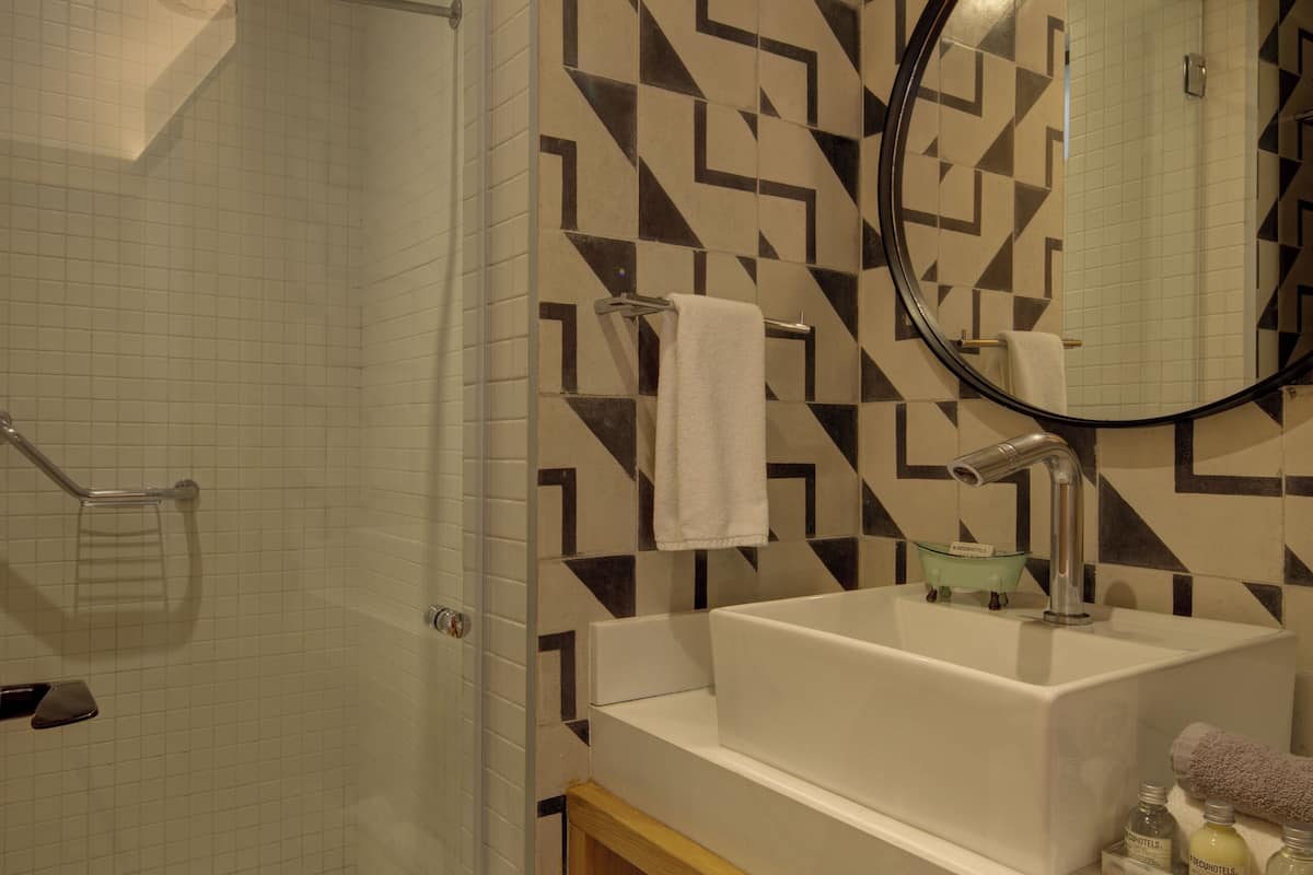 suite duplex | bathroom | shower, rainfall showerhead, hair dryer, towels