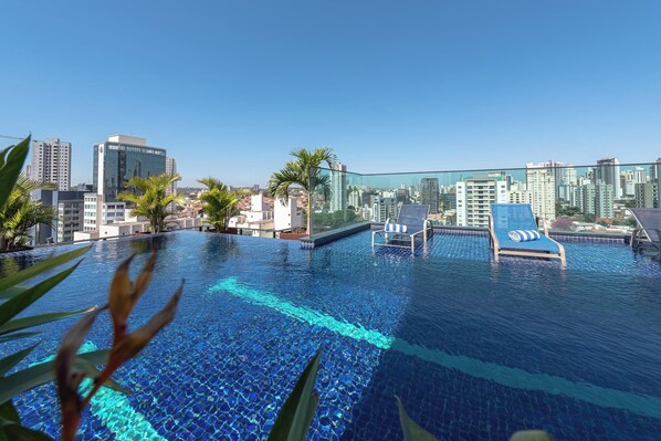 Outdoor pool, pool umbrellas, sun loungers