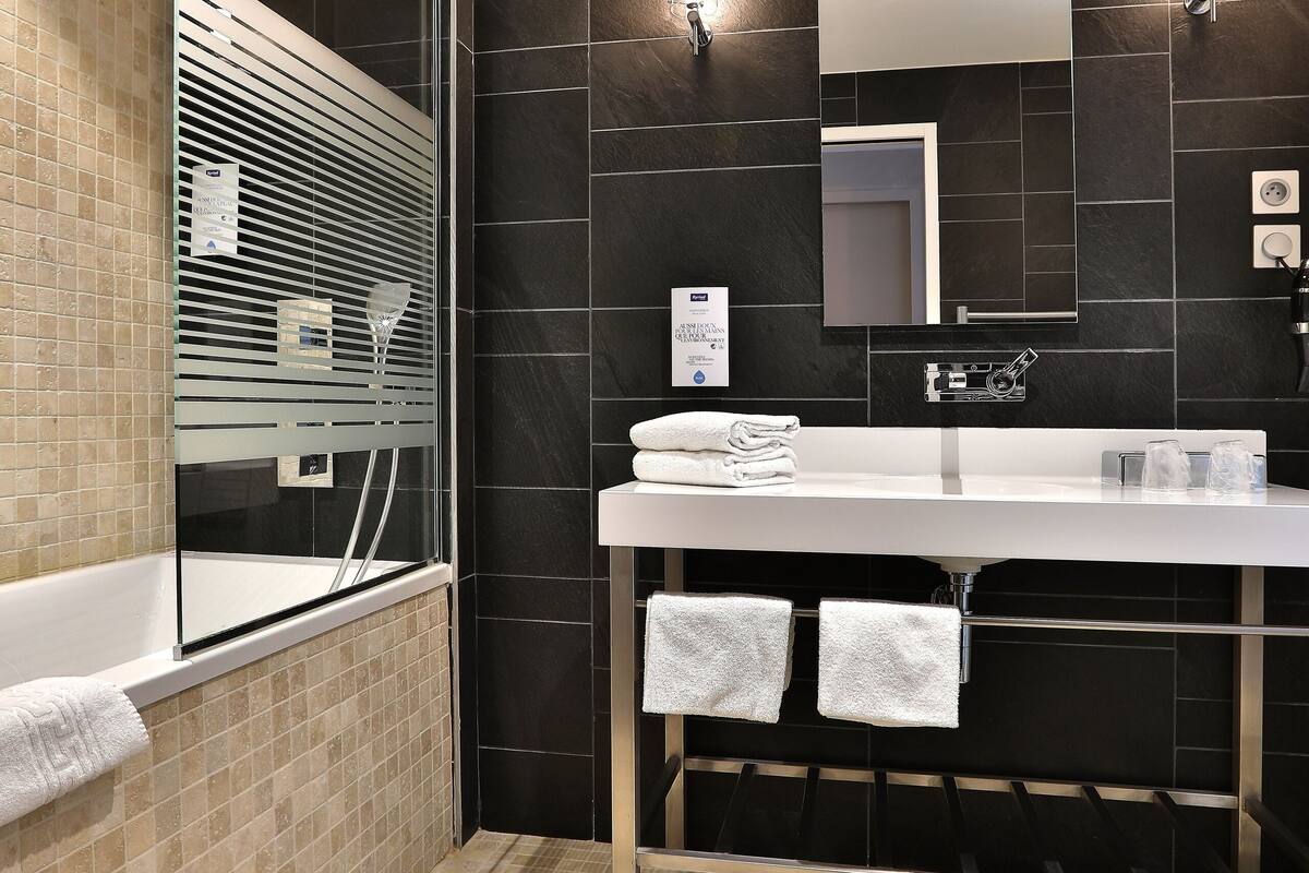 shower, eco-friendly toiletries, hair dryer, towels