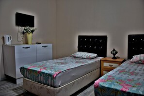 Deluxe suite, 2 slaapkamers | Luxe beddengoed, individueel gedecoreerd, individueel gemeubileerd
