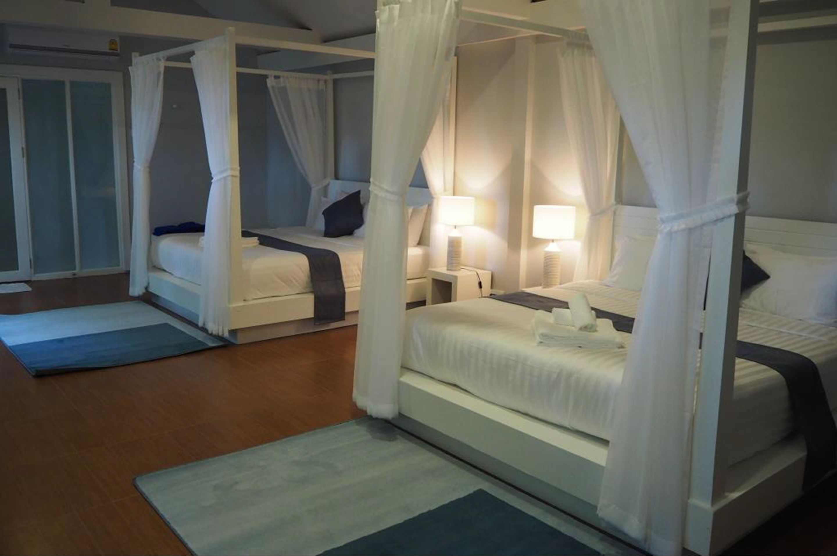 family quadruple room, multiple beds, patio | premium bedding, in-room safe, desk, free wifi