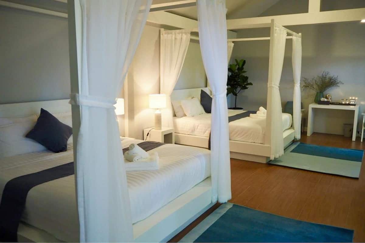 family quadruple room, multiple beds, patio | premium bedding, in-room safe, desk, free wifi