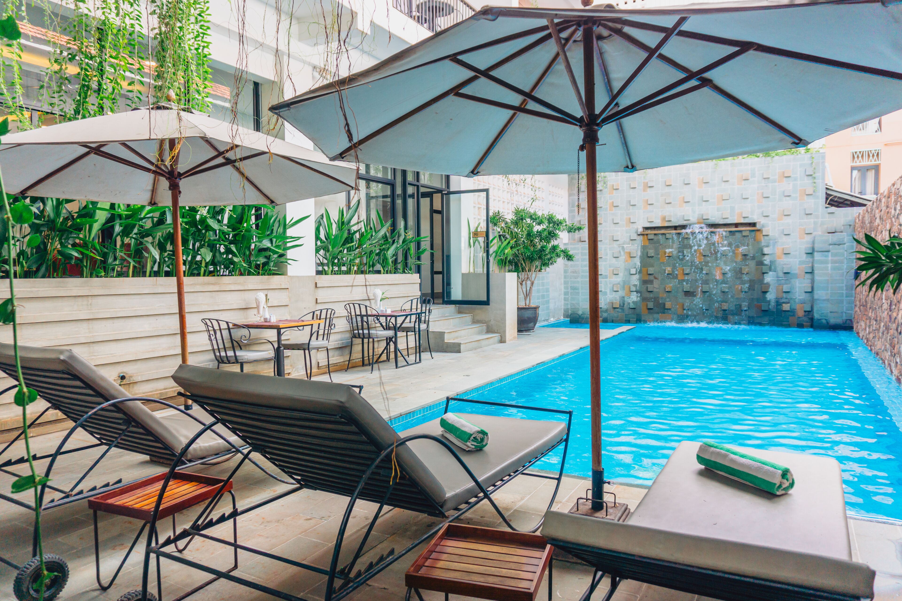 outdoor pool, pool umbrellas, pool loungers