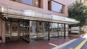 A hotel entrance with a modern design, glass doors, and a clear view of the street. - Alpico Plaza Hotel (Matsumoto)