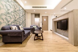 Family Quadruple Room | Living area | LCD TV