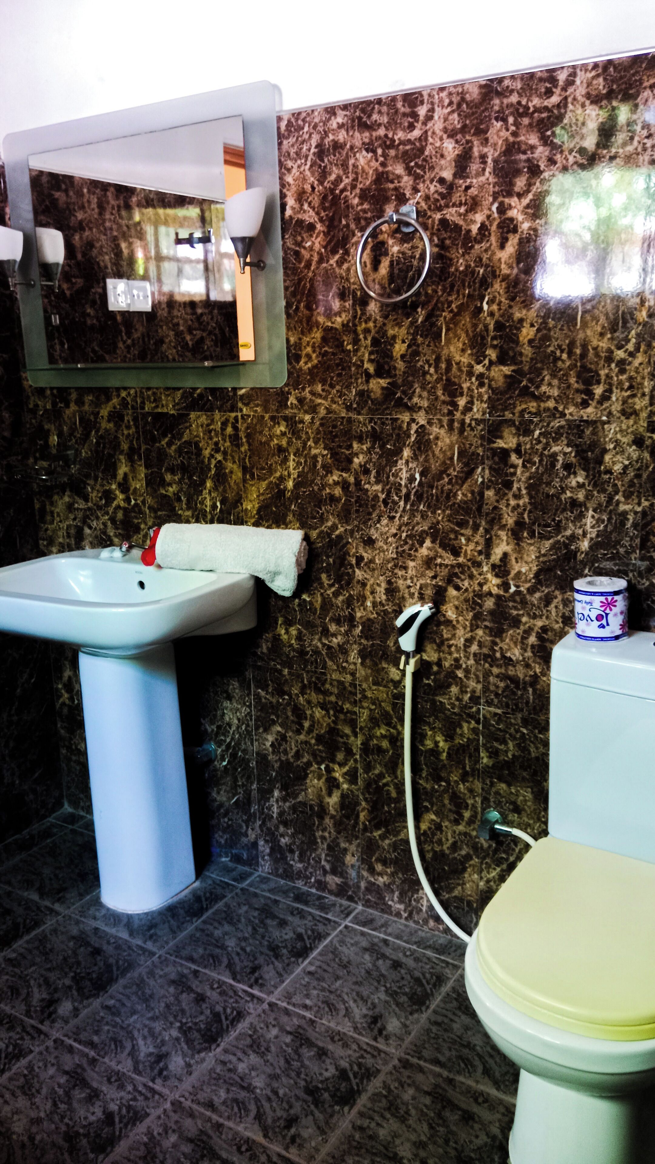 family room | bathroom | shower, rainfall showerhead, free toiletries, bidet