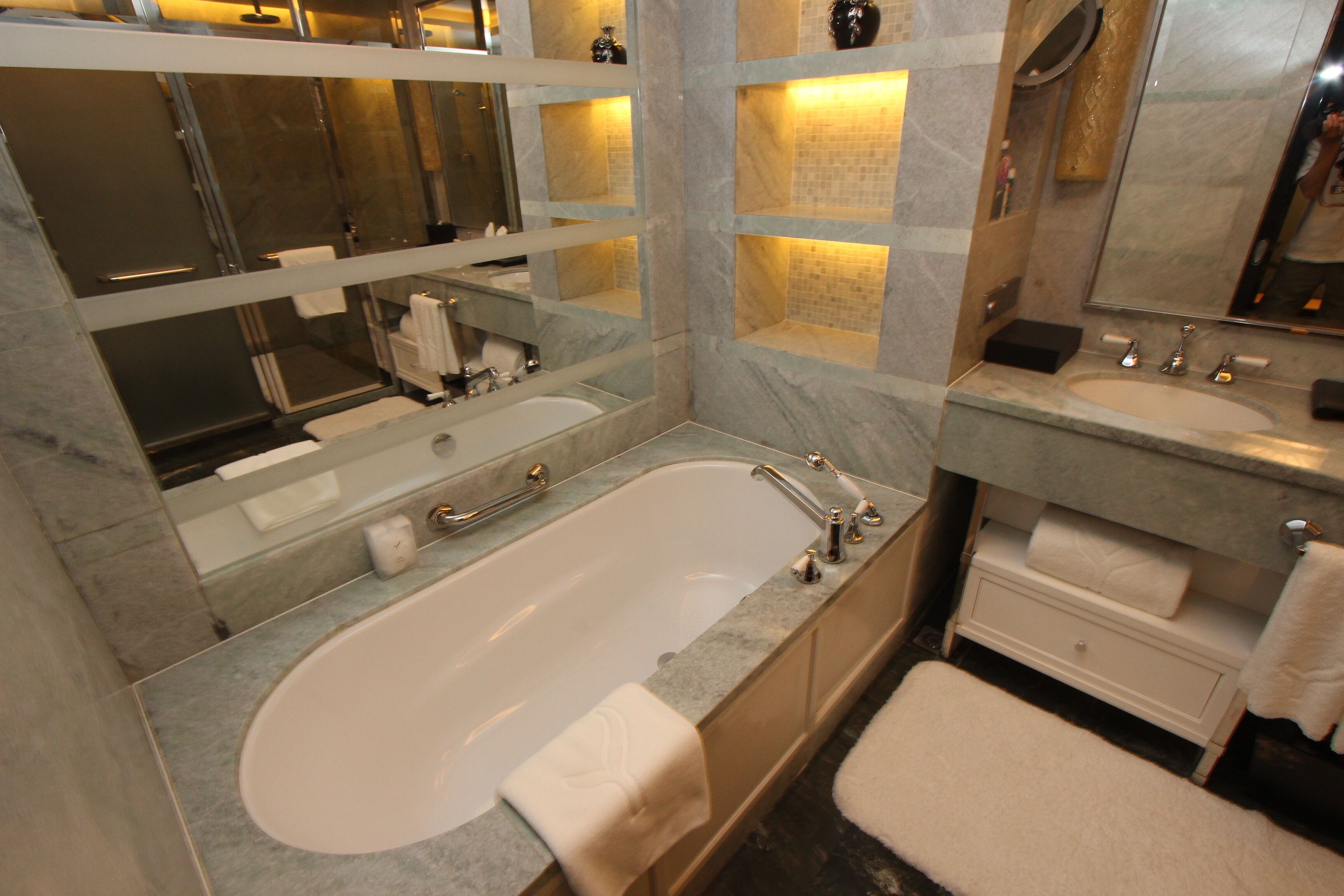 designer toiletries, hair dryer, bathrobes, slippers