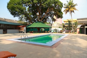 Indoor pool, outdoor pool, open 8 AM to 7 AM, pool umbrellas