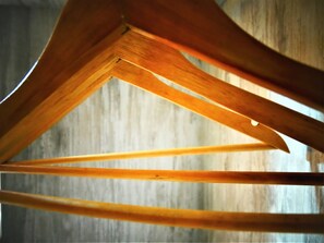 A wooden structure with a triangular design, possibly a part of a room's interior.