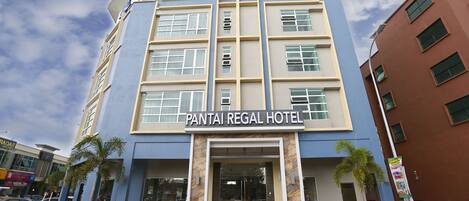 A multi-story building with the sign "Pantai Regal Hotel" at the entrance.