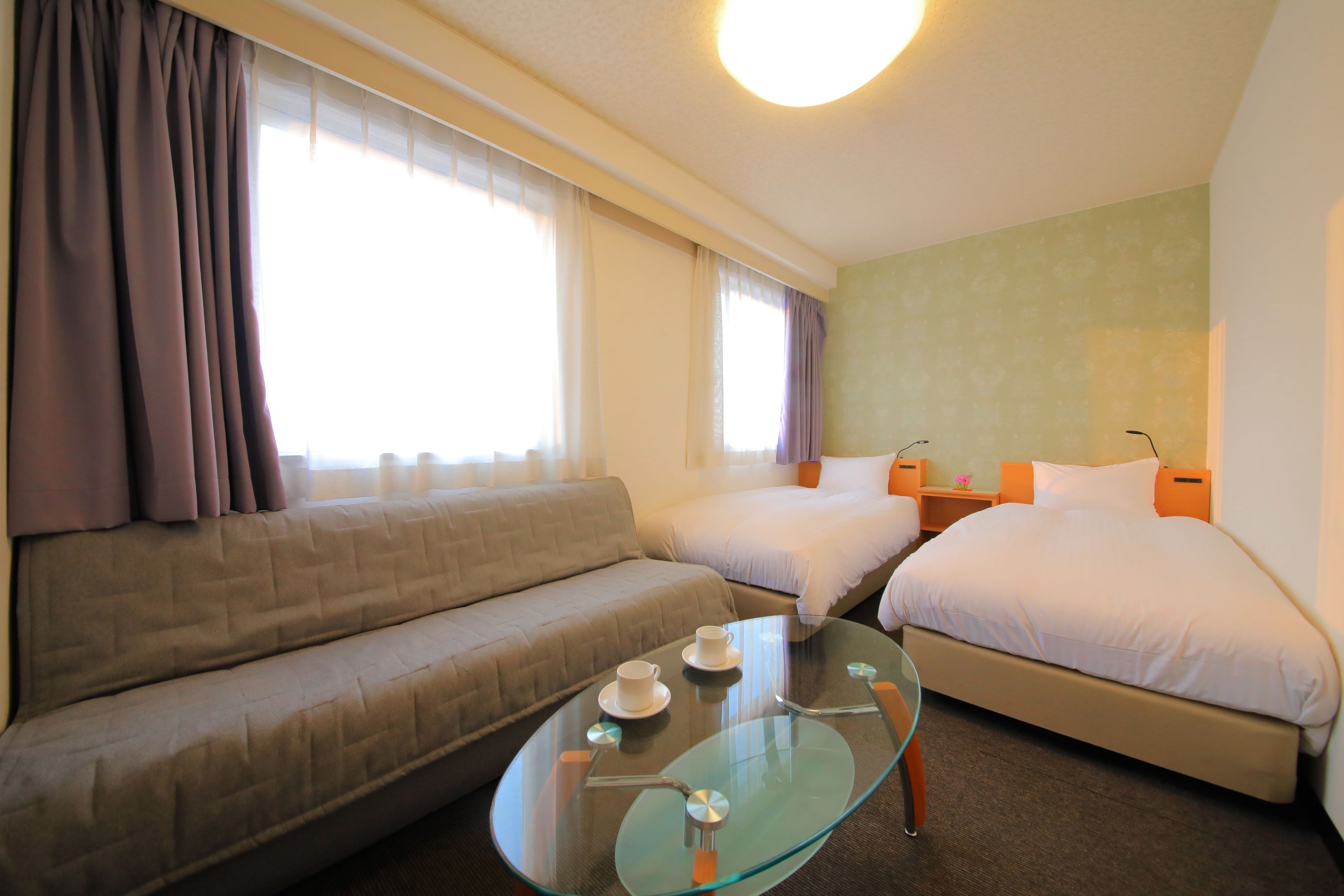 casual twin room, non smoking | in-room safe, desk, laptop workspace, iron/ironing board